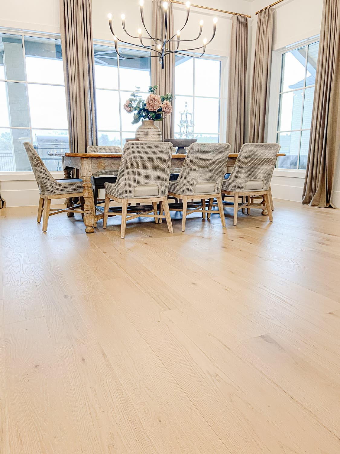 Formal dining room with light wide-plank hardwood — Rise Reno
